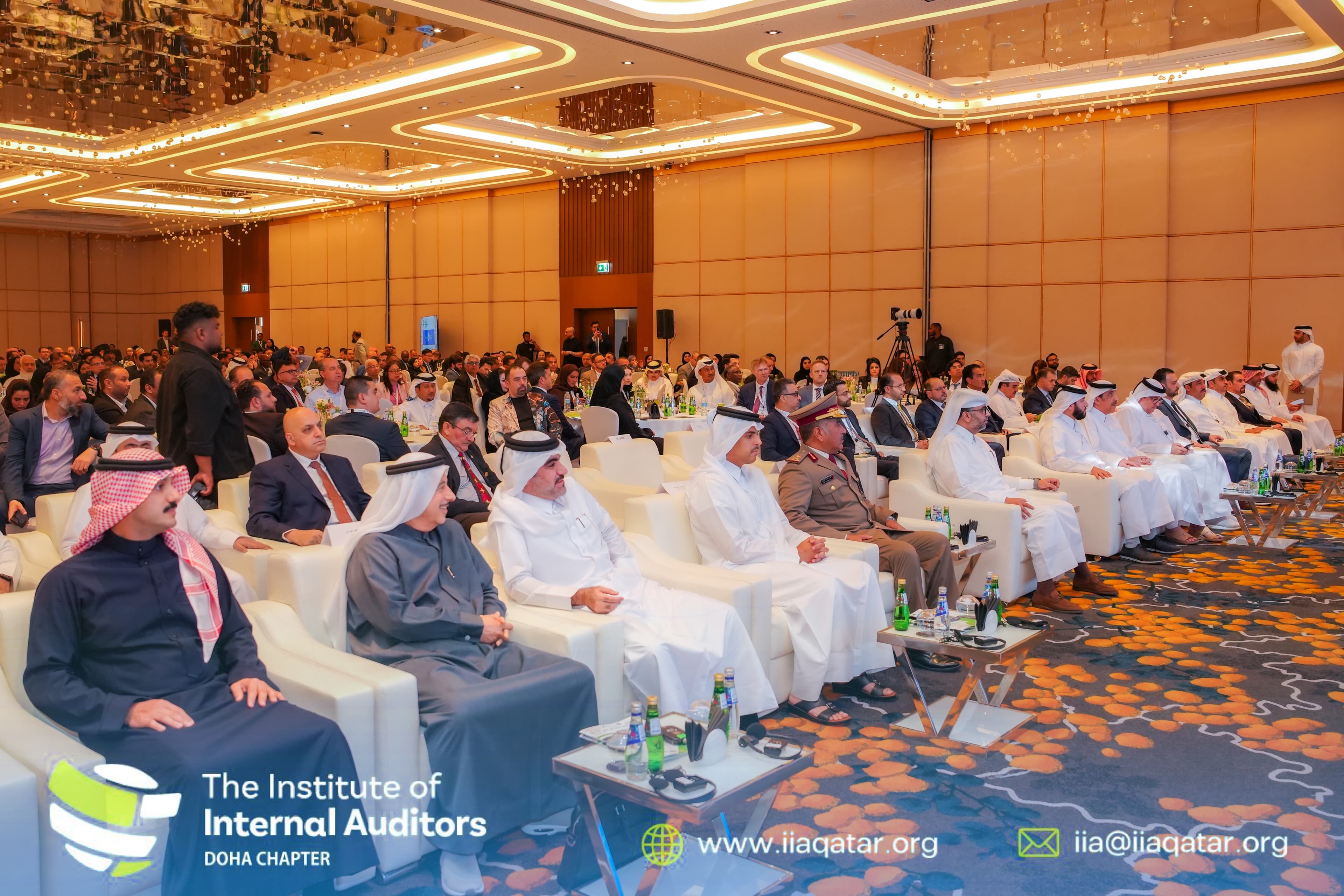 Audience seated in the main hall during a national auditing conference